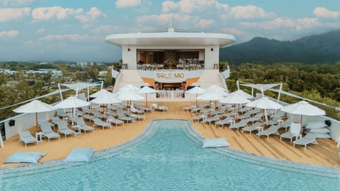 Outdoor pool, open 7:00 AM to 7:00 PM, pool umbrellas, sun loungers