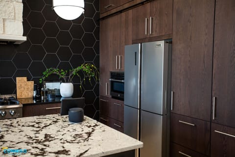 Cook with ease using full-size stainless steel appliances and cookware.