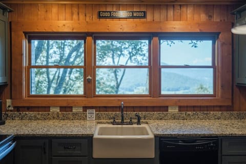 A kitchen sink graced by a luxurious marble countertop.