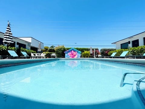 The Pier Walk pool house mural is the perfect backdrop for your next vacation.