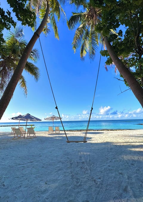 Private beach, white sand, beach umbrellas, beach towels