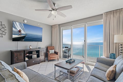 This 3BR/3 BA updated condo features a bright and open living and dining space with tall ceiling, Gulf views, and plenty of seating around a HUGE 77" Smart TV for all your streaming needs.