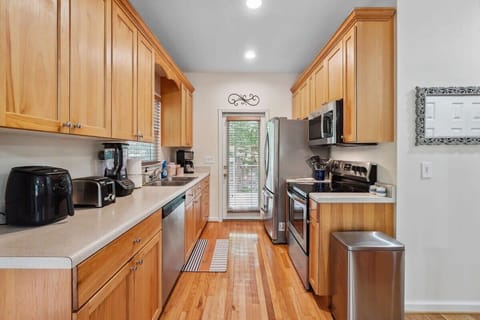 The West side deck, fire table and grill area can be accessed real easy through the kitchen door.