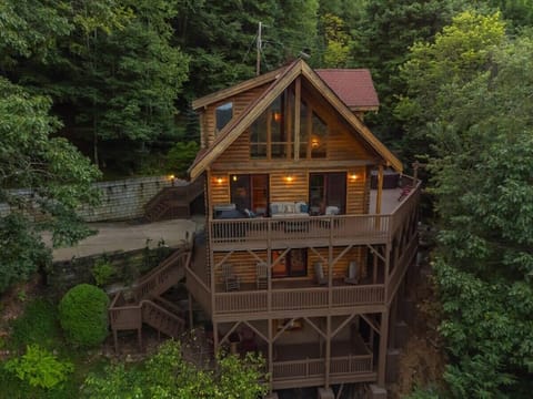 A Bird's Eye View of the Three-story cabin – Get a stunning aerial view of the home, offering a unique perspective of its spacious layout and beautiful surroundings.