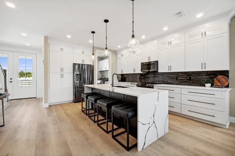 Fully equipped kitchen with stainless appliances and ample prep space on the 2nd floor