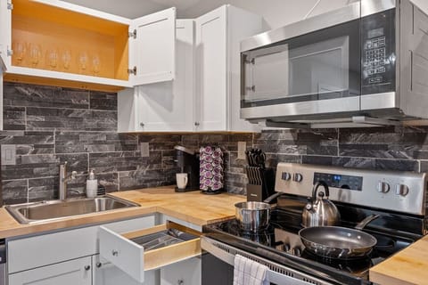 Microwave, stove, oven, and all essential utensils