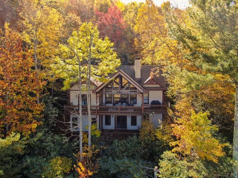 Tucked into the fall color of Blowing Rock, Lake Overlook emerges from the trees with a grand timber facade and spacious upper deck.