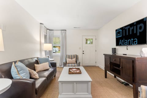 Enjoy a night of games and or TV when hanging out with family and friends on a large leather sofa and all wood flooring