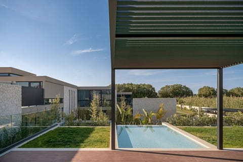 Serene Swimming Area Set Within Lush Gardens