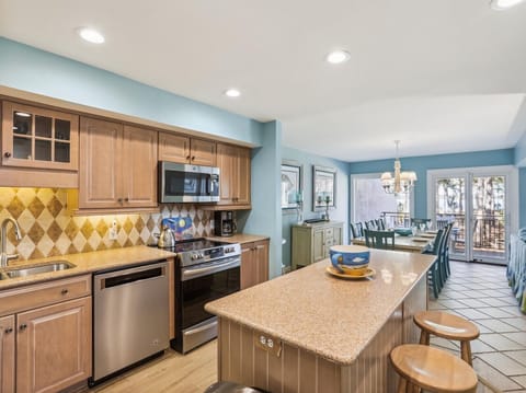 Kitchen with Large Center Island at 1467 Sound Villa