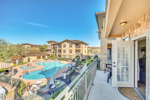 Balcony view overlooking the community pool, perfect for enjoying the sun and relaxing outdoors.

