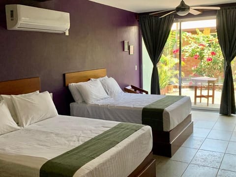 Deluxe Quadruple Room | Premium bedding, pillowtop beds, individually decorated