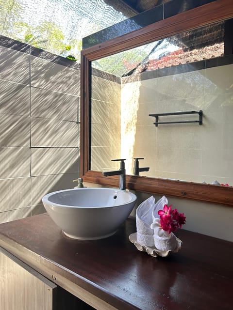 Shower, rainfall showerhead, bidet, towels