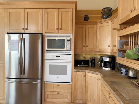 Modern kitchen appliances including combination coffee maker/espresso machine.