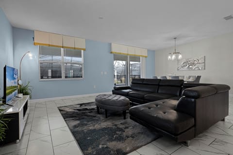 Living area with contemporary furniture and flat screen tv
