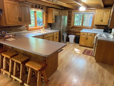 Kitchen with kitchenware, place setting for 12, toaster, coffee pot, & spices
