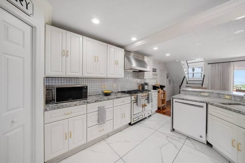 Kitchen with all the works and a double oven Cornue stove.