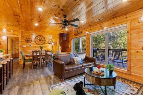 Gather in the spacious open-concept living room with direct access to the main deck, perfect for relaxing together.