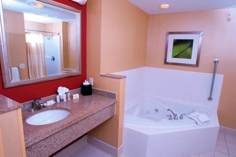 Suite, 1 King Bed with Sofa bed, Fireplace | Bathroom | Hair dryer, towels
