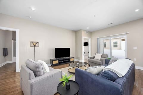 Bright, open-concept living area featuring a cozy sofa bed for lounging or guests.