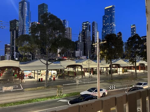 Actual view from the window of the apartment looking out over Queen Vic Markets at Melbourne CBD skyline.