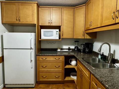 Full Kitchen with baking accessories.