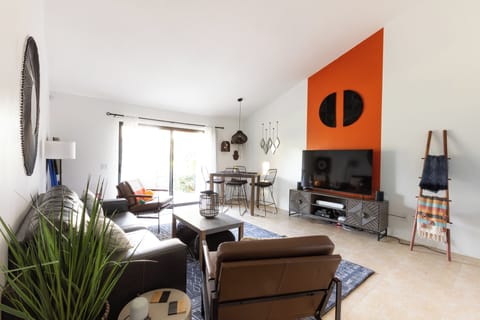 Living room takes you directly out to a large grass greenbelt where the pool is.