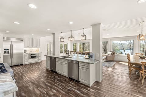 An airy, open-concept living space with expansive lake views—designed to help you unwind and take in the beauty around you.