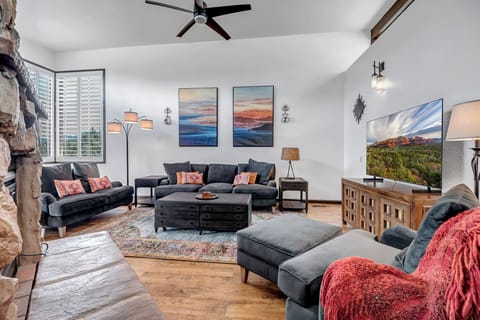 Living Room with Comfortable Seating, Smart TV and Stone Electric Fireplace