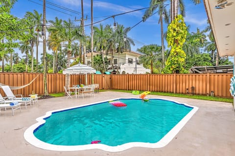 Private pool oasis with palms — perfect for swims, sun, and relaxation.