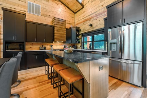 Kitchen, open to the dining room and living room, cook and socialize.