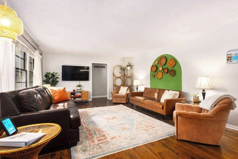 Relax on the comfortable sofas while watching your favorite shows and movies on the
large TV in the living room.
