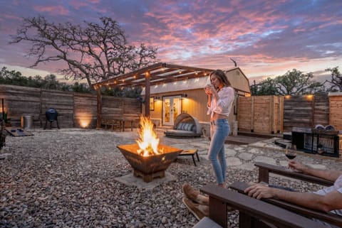 Fire pit nights under big Texas skies. Private yard, string lights, total seclusion.