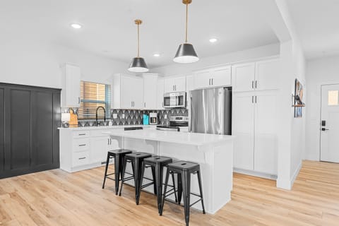 Our fully-stocked kitchen features stainless steel appliances.