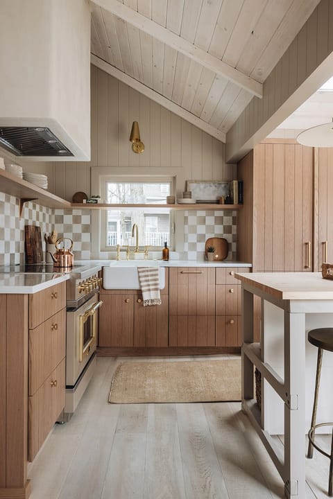 This roomy, smartly designed kitchen inspires the making of scrumptious meals.