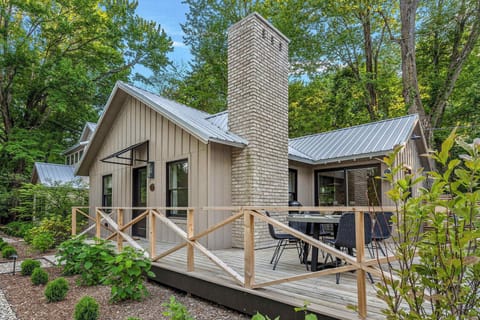 This charming cabin with a cozy deck and inviting patio is the perfect spot to unwind and soak in nature's beauty.