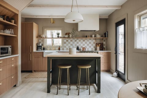 The Fern's fab kitchen island is a frequent gathering spot for morning coffee.