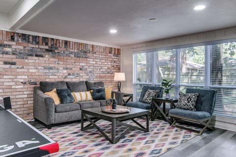 sunroom with ping pong table and pull out couch