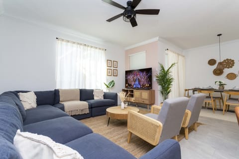Open living space that seamlessly connects the beautiful kitchen and dining area, offering a perfect blend of comfort and style.