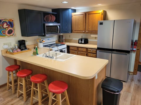 KITCHEN:  The home has a large and modern kitchen with all appliances (including a dishwasher) and a good supply of cooking and dining utensils.
