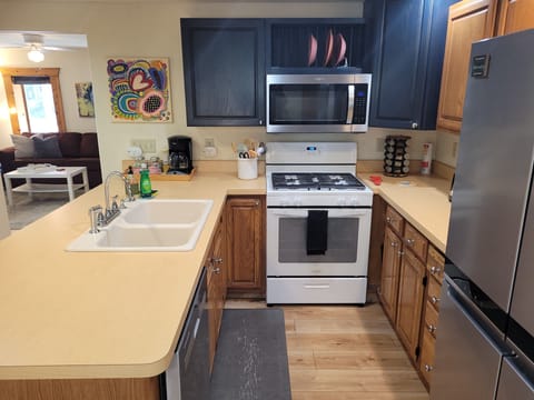 KITCHEN:  The home has a large and modern kitchen with all appliances (including a dishwasher) and a good supply of cooking and dining utensils.