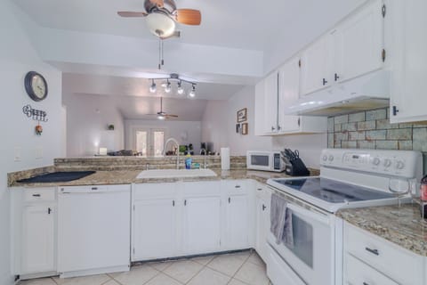 7. Kitchen overviewing the dining room and living room. Fully stocked with pots, pans, blender, toas (2)