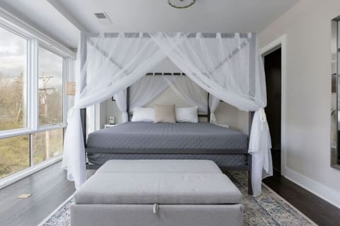 Master bedroom w/ canopy and a beautiful view!