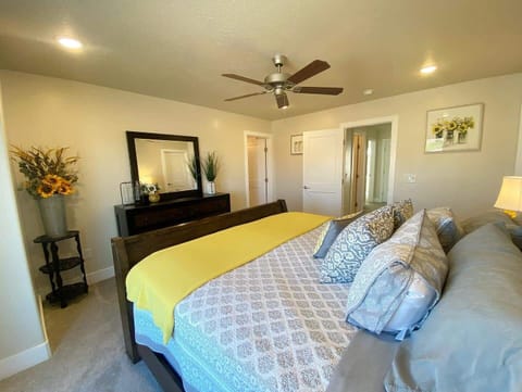 In addition to a comfy bed, this room offers a dresser, ceiling fan, a spacious walk-in closet, and a portable crib for your little one.