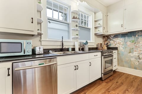 Kitchen fully-stocked with a microwave and toaster.