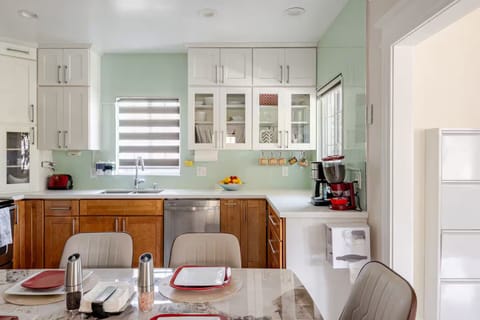 Kitchen: designed for comfort and function with modern appliances & ample space.