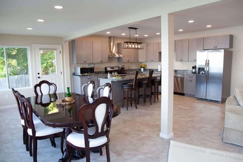 Dining Area- Gather for meals or late-night games around this large dining table.