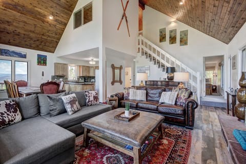 Upper living area - open to the dining area and kitchen, cozy couches and gas fireplace