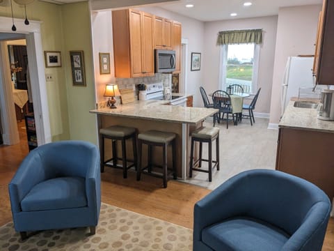 Kitchen with seating for 3 at the counter and 4 at the table.