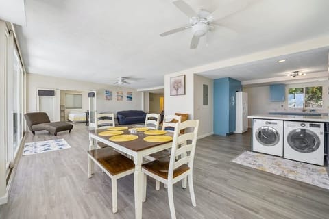 Practical dining area with washer and dryer nearby
